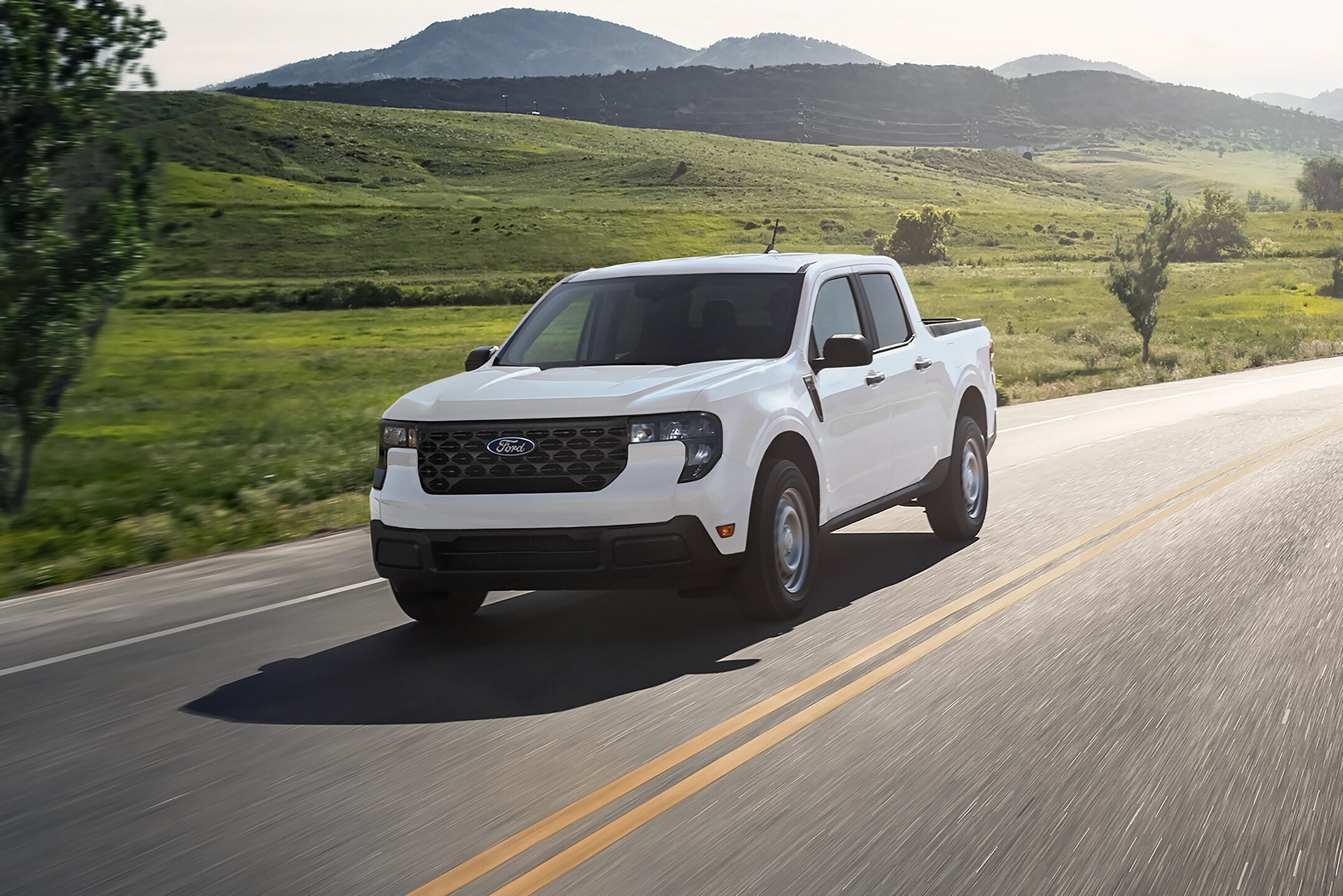 a white 2025 ford maverick driving near Princeton, IL